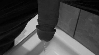 Taking a quick piss on the shower floor, with my semi hard cock