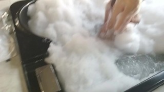 brunette washes her big tits in hydromassage