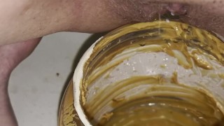 Girl pisses in 5lb jar of peanut butter