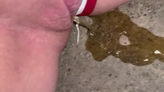 Girl pulls panties to the side to piss on steps