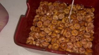 Girl pees in a bowl of cereal