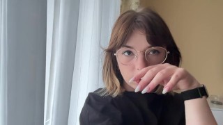 Attractive brunette in a t-shirt shows off her beautiful tits