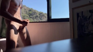 fit teen jerks while watching the neighbours in the garden