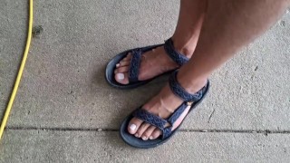 My male pedicured feet in sandals