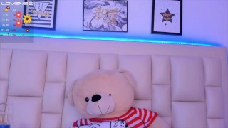 Sexy Latina with a cute face and red hair plays the ukulele naked