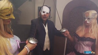 Two masked blonde girls enjoy fucking with the same guy