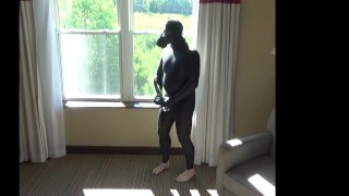 wetsuit and zentai at hotel window