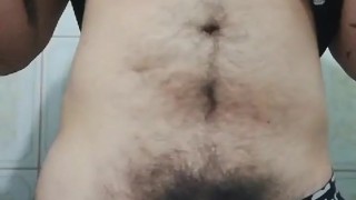 Introvert guy touching himself in the bathroom