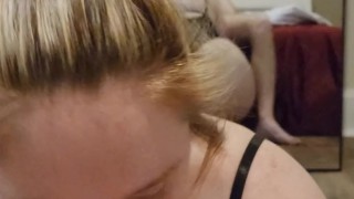 Hunny Rae gives a sloppy blowjob while her ass shakes in the mirror