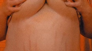 Big tit beauty in red strip tease