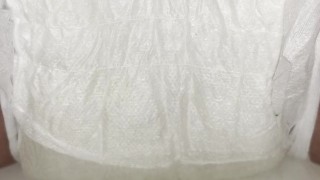 Girl does close up diaper piss with pee press out