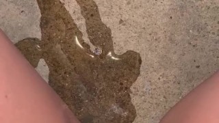 Babe lifts up red nighty to piss on the steps