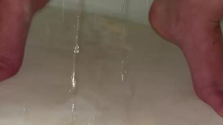 Babe pisses her diaper and then rings it out for the cam