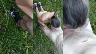 A couple of amateurs fuck standing in the middle of a wild forest