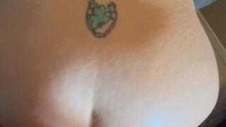 Big tit MILF with nipple clamps and oiled ass, fingers in as and facial