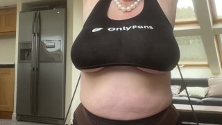 Squeezing huge tits into a tight crop top