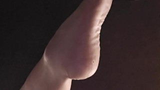 Bored goth girl ignores you under her desk dangling feet and flipping you off