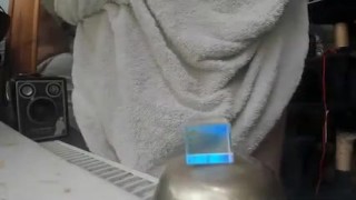 nude male on webcam with a towel