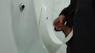 Young twink cruising up public male restroom at a local mall, hoping to catch some curious dicks