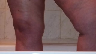 I caught a chubby mom playing with her fat pussy in the shower