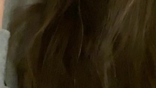 Young pretty brunette sucking her pink toy