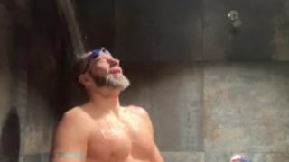 Bearded Swimmer pissing in locker room