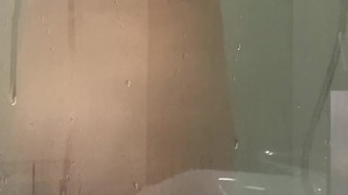 My stepmom is teasing me in the shower, knowing that I'm filming her on my phone camera