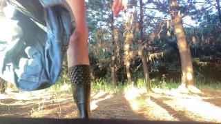 Girl takes off her shorts and panties and pees in the forest