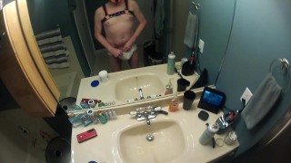 Pup boy in a diaper in the bath tub to play with his penis pump and dildo