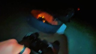 Cumming outside by fire