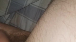 Big hairy cock femboy gives herself a footjob and busts all over herself