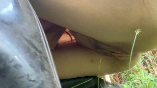 Pissing in the grass in the middle of the trail