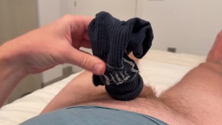 A guy jerks off a dick in a room while everyone is asleep