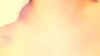 Kitten plays with her titties