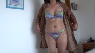 On the beach, stepmom shows off in a bikini and gets my cock really hard