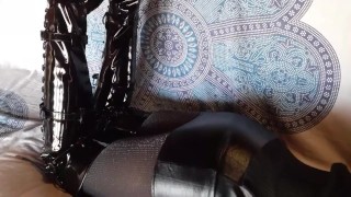 Total black with fishnets pantyhose and boots over the knee