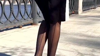 Girl wearing black nylons stockings with garters
