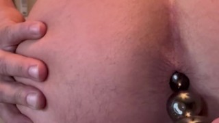 Butt plug with butt piercing